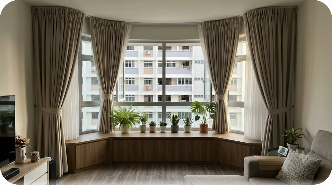 HDB 5-room flat bay window with dim-out curtains and curtain track, showing fabric width and track mounting